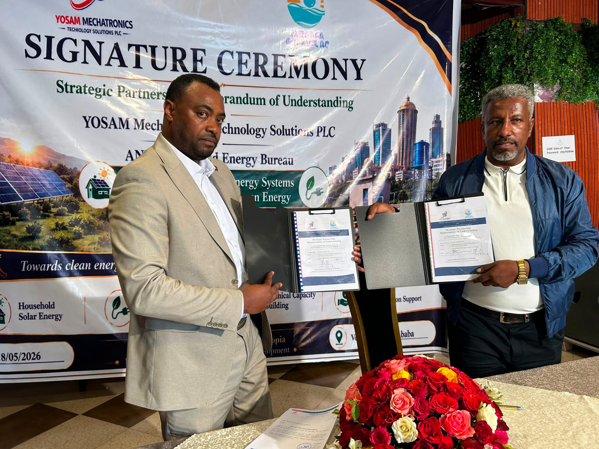 YOSAM Mechatronics and Amhara Region Water and Energy Bureau representatives presenting the signed MoU